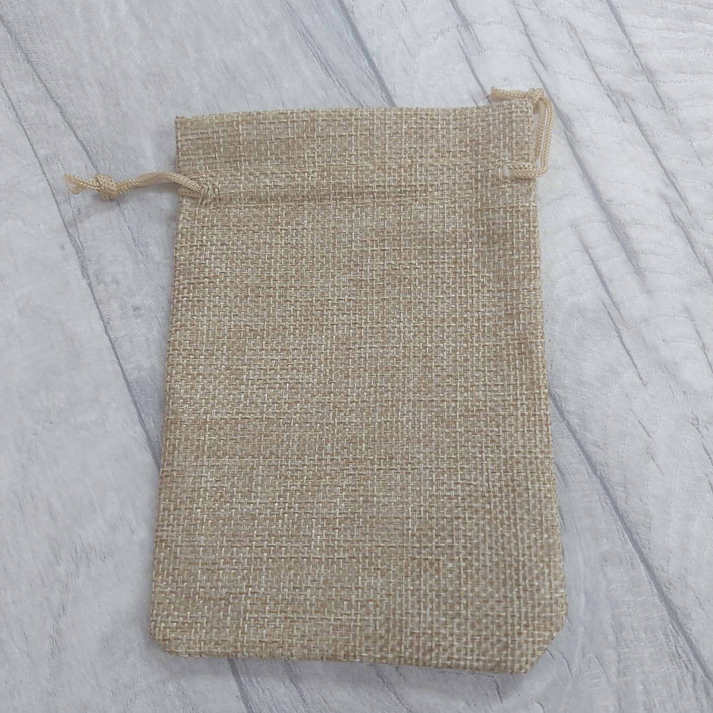 Hessian type drawstring Bag.