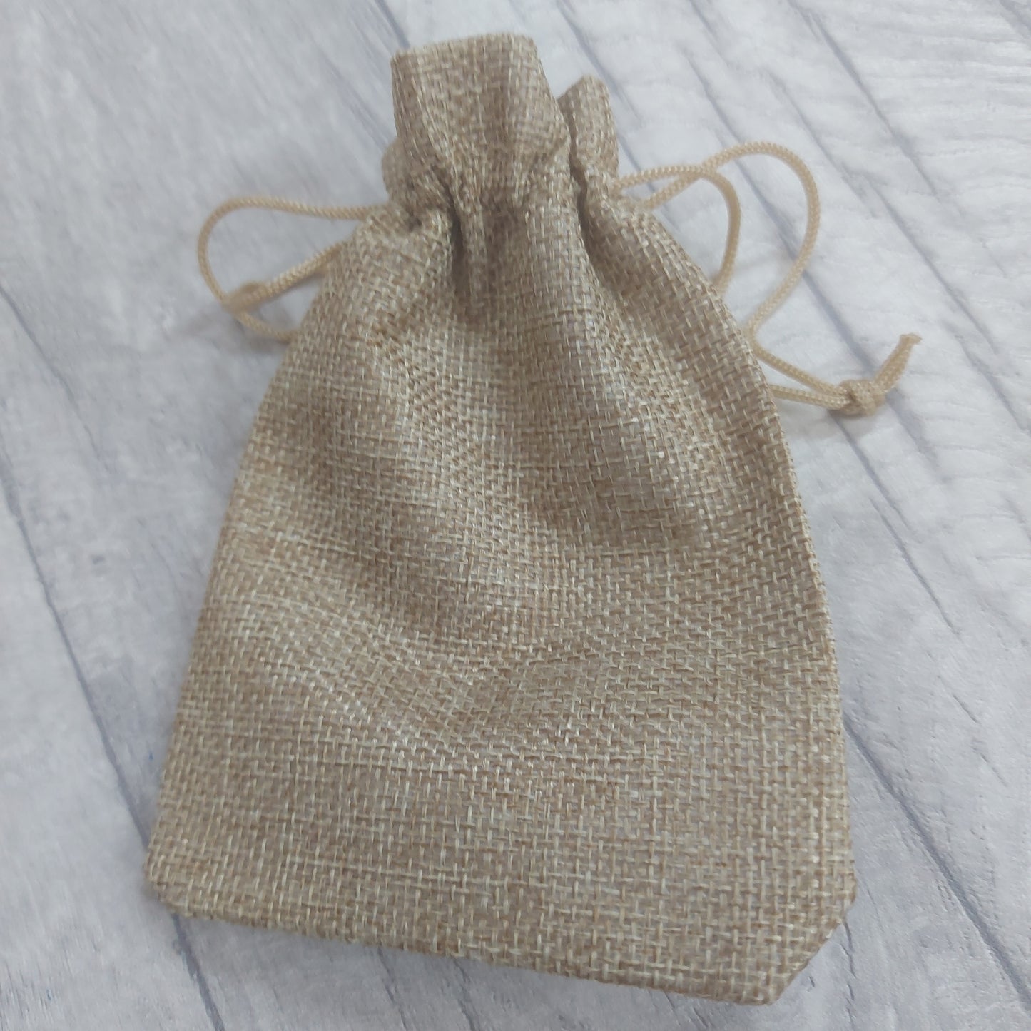 Hessian type drawstring Bag.